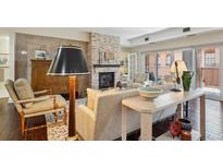 Cozy living room with a fireplace and comfortable seating area at 1512 Larimer St # 39, Denver, CO 80202