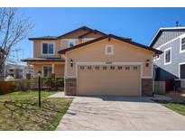 Charming two-story home featuring a neutral color palette, attached two car garage, and well maintained landscaping at 6370 Twilight Ave, Firestone, CO 80504