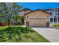 Inviting two-story home featuring a well-manicured lawn and an attached two-car garage at 6370 Twilight Ave, Firestone, CO 80504