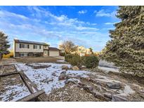 Ranch style home with a landscaped front yard and solar panels at 12263 Clermont Ct, Thornton, CO 80241