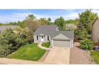 Charming single-Gathering home with a well-manicured lawn and an attached two-car garage in a lovely neighborhood at 904 Clover Cir, Lafayette, CO 80026