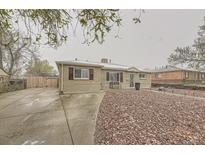 Cozy one-story home featuring a charming brick exterior and landscaped front yard at 9391 Lilly Ct, Thornton, CO 80229