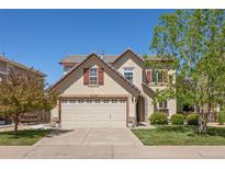 Charming two-story home with a well-manicured lawn, a two-car garage and beautiful curb appeal at 4194 Beautiful Cir, Castle Rock, CO 80109