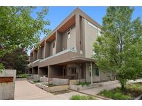 Modern townhome exterior with covered entryway and contemporary architectural details at 48 Galapago St, Denver, CO 80223