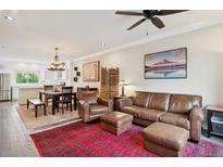 Bright, open-concept living space with hardwood floors and neutral walls for versatile decor at 48 Galapago St, Denver, CO 80223
