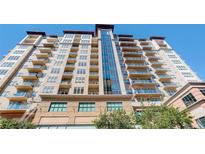 Multi-story building with multiple floors, balconies, and windows, perfect for luxury living at 5455 Landmark Pl # 407, Greenwood Village, CO 80111