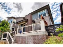 Stylish multi-story home featuring a brick accent wall, covered porch, and well-maintained landscaping at 4100 Albion St # 1509, Denver, CO 80216