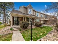 Charming townhome with well-maintained front yard and welcoming covered entryway at 5316 S Jellison St, Littleton, CO 80123