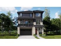 Two-story home with gray siding, stone accents, and a two-car garage at 6646 E 149Th Ave, Thornton, CO 80602