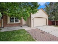 Charming single-Gathering home featuring a two-car garage and a well-manicured lawn at 8401 Sandreed Cir, Parker, CO 80134
