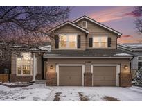 Charming two-story home featuring a two-car garage, brick accents and beautiful landscaping at 13486 Clayton St, Thornton, CO 80241