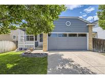 Charming single-Gathering home with a two-car garage and manicured lawn at 17692 E Brown Cir, Aurora, CO 80013