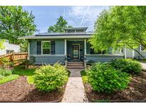 Charming single-story home featuring a landscaped front yard, covered porch, and attractive curb appeal at 3116 S Lincoln St, Englewood, CO 80113
