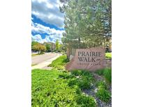 Prairie Walk on Cherry Creek community entrance with landscaping and signage at 17346 Nature Walk Trail # 105, Parker, CO 80134