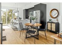 Modern kitchen with stainless steel appliances and island at 1682 Tabor St, Lakewood, CO 80215