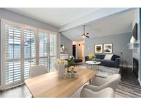 Open dining room, seamlessly connected to living room with great light and comfortable seating at 2504 S Victor St # E, Aurora, CO 80014