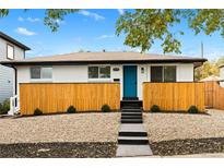 Charming home featuring a bright blue door, modern landscaping, and a freshly painted exterior at 3220 W 8Th Ave, Denver, CO 80204