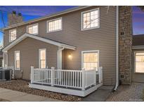 Charming home featuring a cozy front porch, stone accents, and classic siding for lasting curb appeal at 8462 Everett Way # B, Arvada, CO 80005