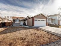 Charming single-story home with a two-car garage and freshly landscaped front yard at 1980 W 132Nd Ave, Denver, CO 80234