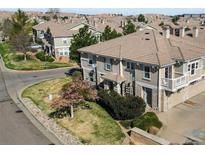 Beautiful two-story townhome featuring stone accents, manicured lawn and low maintenance landscaping at 9792 Mayfair St # F, Englewood, CO 80112