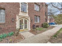 Charming brick building entrance featuring a decorative archway and elegant glass doors at 2115 E 14Th Ave # 8, Denver, CO 80206