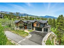 Stunning modern home with mountain views, professional landscaping and driveway at 444 Glen Eagle Loop, Breckenridge, CO 80424