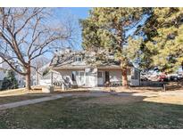 Charming townhome featuring a well-maintained lawn, mature trees, and convenient front access at 8701 Huron St # 5-210, Thornton, CO 80260