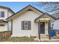 Charming home featuring an inviting front porch and classic architectural details at 2886 S Acoma St, Englewood, CO 80110