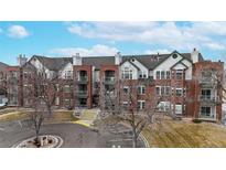 Attractive brick multi-Gathering exterior with balconies and well-maintained landscaping at 2897 W Riverwalk Cir # 204, Littleton, CO 80123
