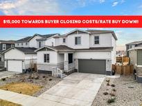 Beautiful two-story home with a two car garage and well-manicured front yard at 1408 Brookfield Pl, Lafayette, CO 80026