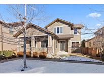 Two-story home with front porch and landscaping at 10366 Bluffmont Dr, Lone Tree, CO 80124