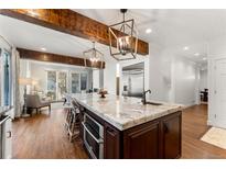 Modern kitchen with marble countertops and large island at 2805 E 4Th Ave, Denver, CO 80206