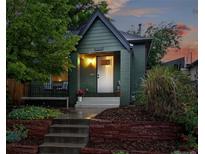 Charming home with an inviting front porch, beautiful landscaping, and a well-maintained exterior at 1331 Osceola St, Denver, CO 80204