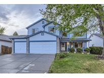 Charming two-story home with stone accents, three-car garage, landscaped lawn, and a classic, welcoming facade at 5455 W 112Th Pl, Westminster, CO 80020
