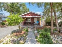 Charming single-story home with a cozy front porch, well-kept landscaping, and inviting curb appeal at 358 S Osceola St, Denver, CO 80219