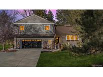 Charming two-story home featuring a well-manicured lawn and inviting curb appeal at 6269 S Coventry E Ln, Littleton, CO 80123