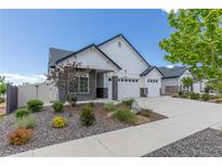 Charming single-Gathering home with manicured landscaping and a three-car garage for ample parking and storage at 21701 E 50Th Dr, Aurora, CO 80019