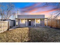 Charming bungalow-style home with a cozy front porch and well-maintained lawn at 3930 W Kentucky Ave, Denver, CO 80219