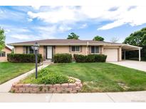 Charming ranch home featuring a well-manicured lawn and inviting curb appeal at 6666 S Pennsylvania St, Centennial, CO 80121