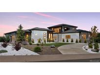 Beautiful exterior elevation of the home with landscaping and modern design elements at 6915 Tremolite Dr, Castle Rock, CO 80108