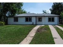 Charming single-story home with a well-maintained lawn and a concrete driveway at 1032 Geneva, Aurora, CO 80010
