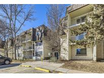 Attractive exterior of a multi-unit building with landscaping and parking at 2225 S Jasmine St # 304, Denver, CO 80222