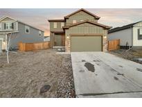 Two-story house with attached garage and landscaped front yard at 810 N Vandriver Way, Aurora, CO 80018