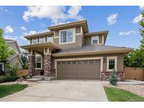 Charming two-story home with a two car garage and neutral colored siding at 2934 Braeburn Way, Highlands Ranch, CO 80126