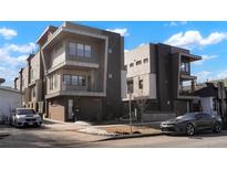 Modern multi-unit building with sleek design and attractive landscaping at 2728 W 26Th Ave # 104, Denver, CO 80211