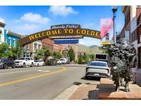 View of the Welcome to Golden sign with a statue of a bison and buildings on a sunny day at 409 Lookout View Dr, Golden, CO 80401