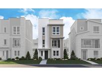 New construction exterior elevation features a modern design and professional landscaping at 1219 Rhett Dr, Erie, CO 80026