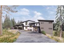 Stunning modern home boasts a sleek design with multi-car garage and beautiful landscaping at 13415 S Resort Dr, Conifer, CO 80433