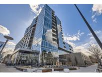 Modern building featuring a reflective glass exterior and unique architectural design at 4200 W 17Th Ave # 1013, Denver, CO 80204