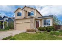 Charming two-story home with a two car garage and manicured lawn in a residential neighborhood at 4915 Parsons Way, Castle Rock, CO 80104